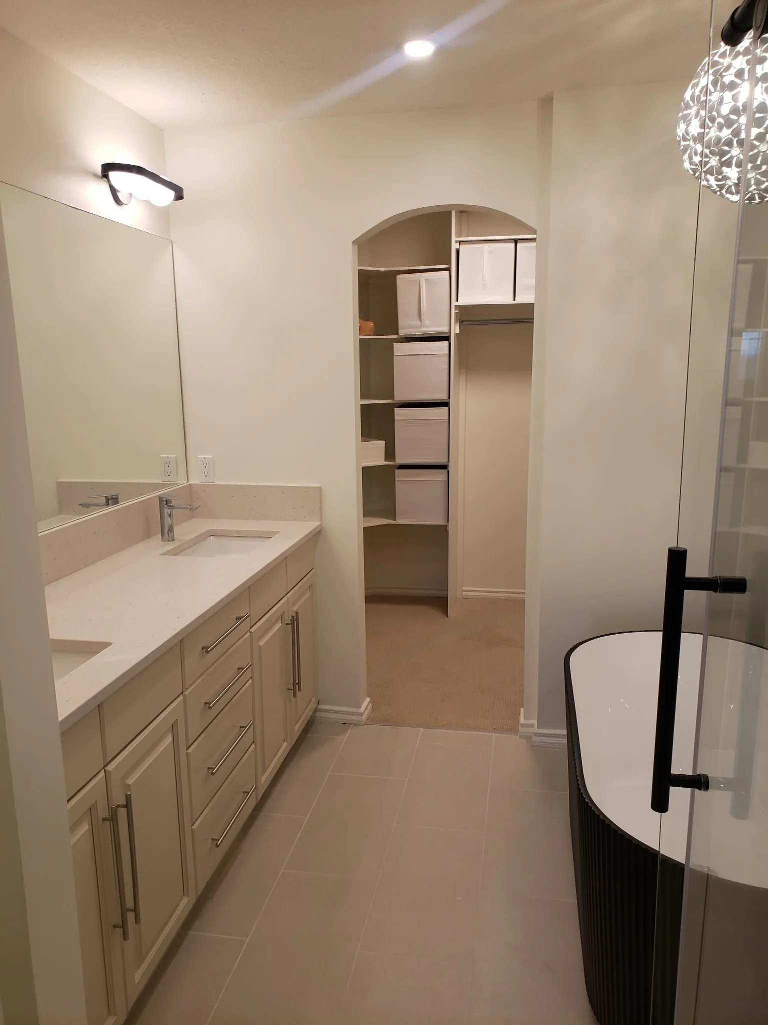 Renovated bathroom with vanity and tub
