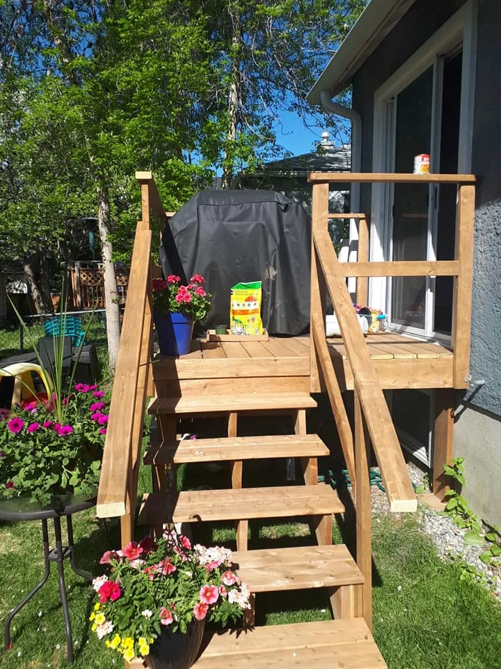 Wood deck and stairs at rear of home