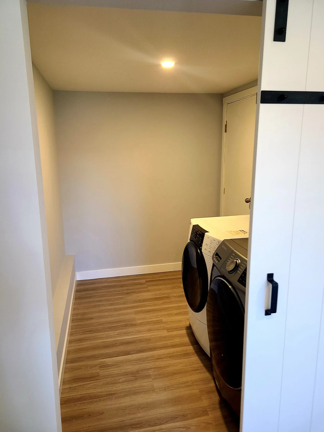 Finished living area with custom barn door